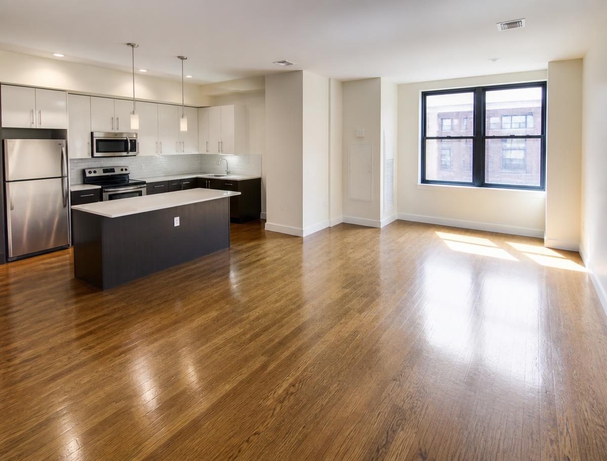 North Bay apartment after a move-out deep cleaning, spotless hardwood floors and clean kitchen